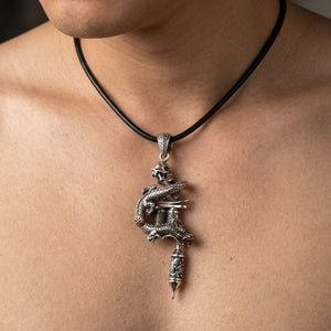 Dragon Skull Tattoo Machine Sterling Silver Pendant, shown at the neck on an adult model; cord or chain is styling context