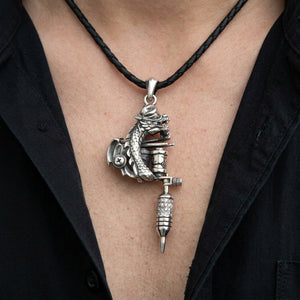 Dragon Tattoo Machine Sterling Silver Pendant worn on a black cord against an adult chest