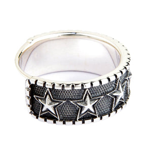 Embossed Star Sterling Silver Band Ring. Three star front angle.