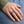 Embossed Star Sterling Silver Band Ring worn on an adult hand.