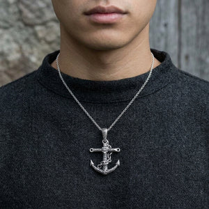 Engraved anchor sterling silver pendant worn over a charcoal Nordic style shirt