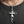 Flame Cross Sterling Silver Pendant, worn at the neckline