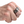 Sterling silver flame skull ring worn on a fair-skinned hand