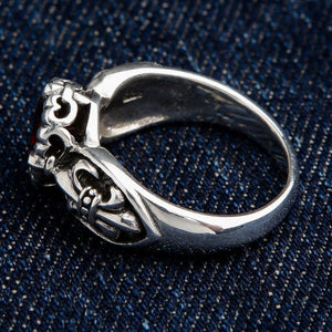 Back detail view of antique finish sterling silver red stone ring showing fleur de lis craftsmanship