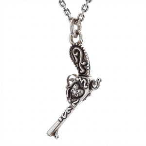 Flintlock Pistol and Heart Sterling Silver Pendant shown in barrel down hanging view.