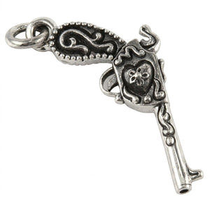 Flintlock Pistol and Heart Sterling Silver Pendant shown in hanging scrollwork detail view.
