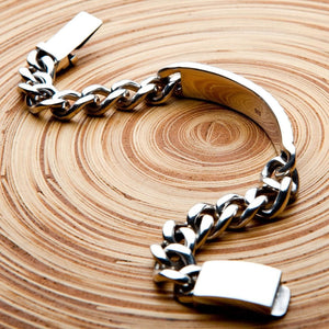 ID-armband i 925 sterlingsilver med blomgravyr, slät baksida på ID-brickan