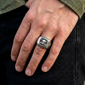 Gamble Skull and Crossbones Silver Signet Ring worn on an adult hand.