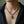Garnet-Eye Skull Sterling Silver Necklace, worn with the clasp hidden behind the neck