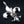 Fleur-de-Lis-Anhänger aus Sterlingsilber mit Granat, Ansicht der polierten Lilie schräg von rechts
