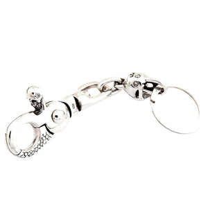 Schedel sleutelhanger van .925 sterling zilver met granaatogen, randprofiel
