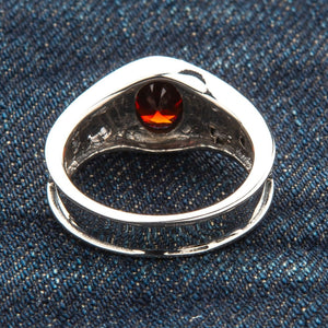 Synthetic Garnet Fleur-de-Lis Sterling Silver Ring, back band on fabric