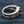 Synthetic Garnet Fleur-de-Lis Sterling Silver Ring, inner band on fabric