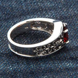Synthetic Garnet Fleur-de-Lis Sterling Silver Ring, inner band on fabric