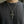 Skull Cross Pendant with Gold-Finished Center, worn at the neckline