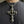 Skull Cross Pendant with Gold-Finished Center, worn at the neckline