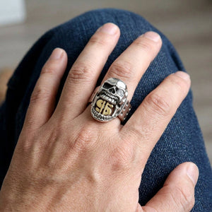 Gold Dollar Sign Skull Sterling Silver Ring, worn on the hand
