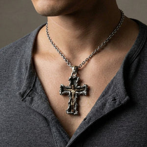 Gold Jesus crucifix pendant worn at the neckline