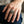 Gold Spider Web Sterling Silver Gothic Ring with wide web face and short safety chain, worn on the hand
