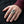 Green CZ Tribal Face Sterling Silver Ring worn on an adult hand.