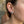 Green Eye Oni Mask Sterling Silver Stud Earrings, worn at the ear on an adult model