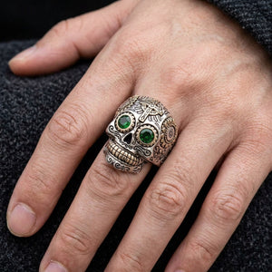 Green-Eye Sugar Skull Sterling Silver Ring worn on an adult hand
