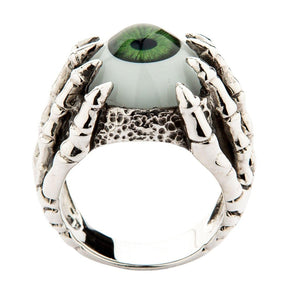 Drakkloring i sterlingsilver med grönt öga, vy uppifrån av gotisk ring med grönt öga som visar symmetrisk kloplacering och ögondetaljer