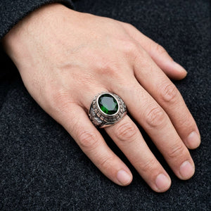 Green Stone Tiger and Dragon Sterling Silver Ring worn on an adult hand
