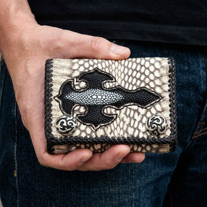 Grey Cobra and Stingray Cross Trifold Biker Wallet, held at hip level