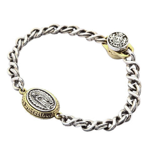 Guadalupe Silver and Brass Medallion Bracelet showing the decorated cap and oval relief viewed from above.