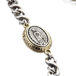 Guadalupe Silver and Brass Medallion Bracelet showing the silver Guadalupe relief inside its brass frame.