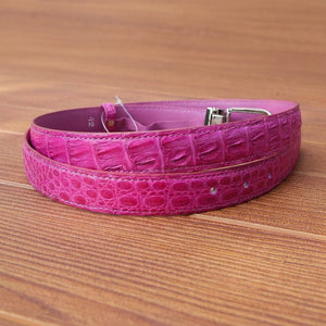 Handcrafted pink crocodile belt showing natural scale pattern and leather lining
