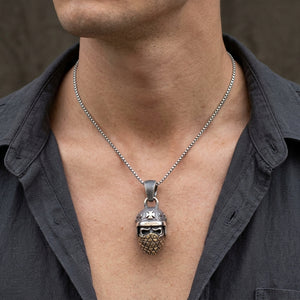Outlaw Biker Skull Sterling Silver & Brass Pendant, worn on a neutral styling chain from chin down with collarbones, shoulders and upper chest visible; chain not included