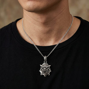 Japanese demon mask silver pendant worn at the neckline