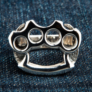 Knuckle Duster Sterling Silver Ring, ring on denim front