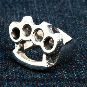 Knuckle Duster Sterling Silver Ring, ring on denim side