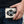 Komodo and Stingray Cross Leather Bifold Wallet, held at hip level