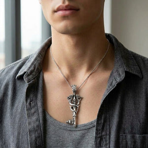 Dragon Key Sterling Silver Pendant shown larger on the upper chest