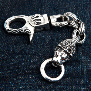 Red-Eye Lion Head Sterling Silver Keychain showing lion head, red eyes and flame links curved between clasp and ring.