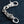 Red-Eye Lion Head Sterling Silver Keychain showing lion head and flame clasp in an opposite curved layout.