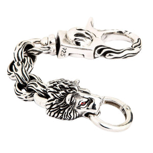Red-Eye Lion Head Sterling Silver Keychain showing the lion, twisted links and 925 mark at an angle.