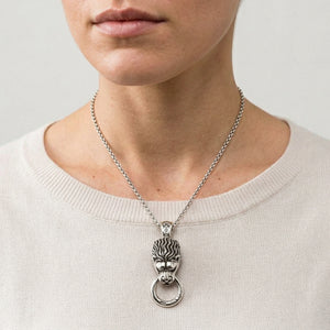 Lion Head Door Knocker Sterling Silver Pendant, shown at the neck on an adult model; cord or chain is styling context