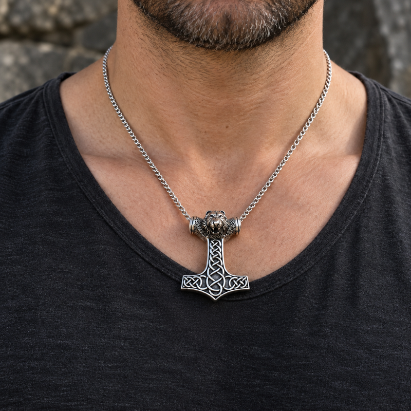 Lion knot Thor hammer silver pendant worn on a model