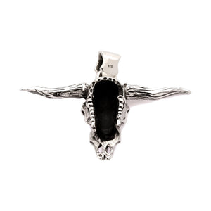 Dije de calavera de toro longhorn en plata de ley 925, reverso hueco de la calavera y sello de contraste en la fianza