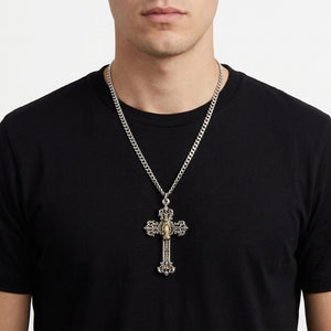Ornate Mary cross pendant on a 3 mm sterling silver curb chain over a black shirt