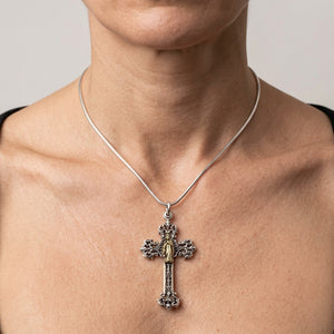 Mary Angel Two-Tone Sterling Silver Cross Pendant, shown at the neck on an adult model; cord or chain is styling context