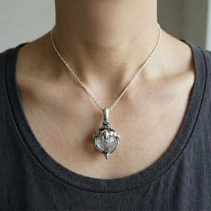 Moonstone Tribal Blossom Sterling Silver Pendant worn on a fine chain, showing the neck and collarbones