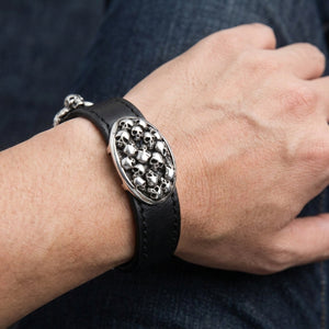 Multi-Skull Sterling Silver Leather Bracelet, worn on wrist