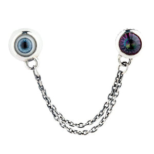 Two linked silver studs showing the drape of both chains