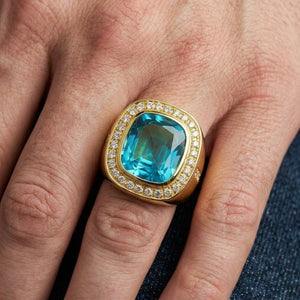 Natural Blue Topaz Gold-Plated Silver Ring worn on the hand at an enlarged scale